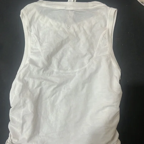 This is a white, size 4, Lululemon drawstring tank top! No stains! Smoke free 🏠 - Picture 3 of 4
